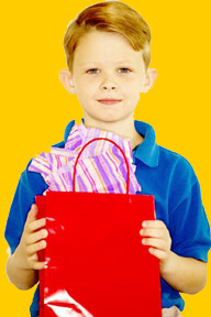 This is a photo of a boy holding bags.