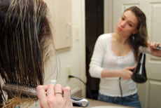 this is a photo of a person drying their hair.